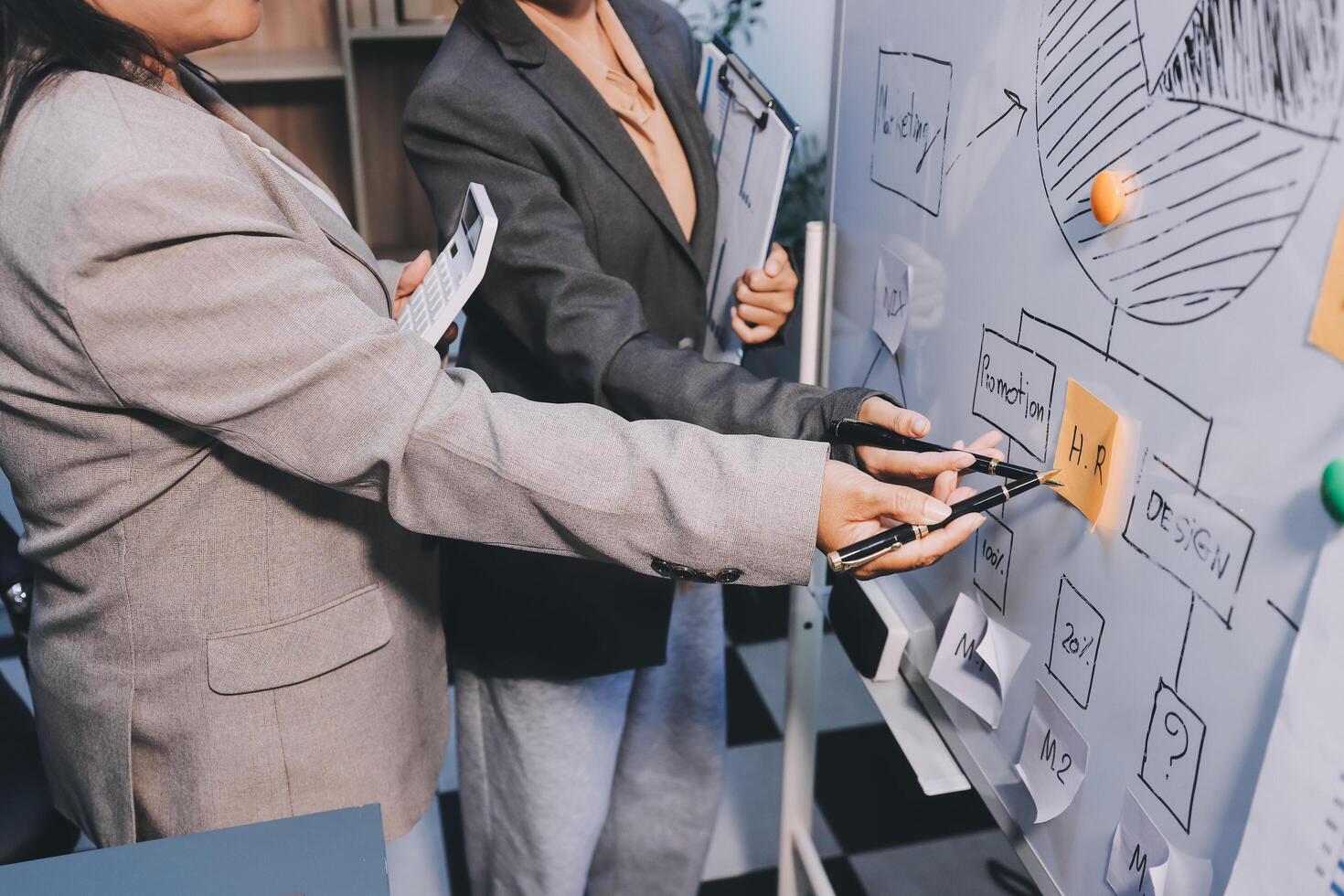 Business people are analyzing and planning business strategies. photo