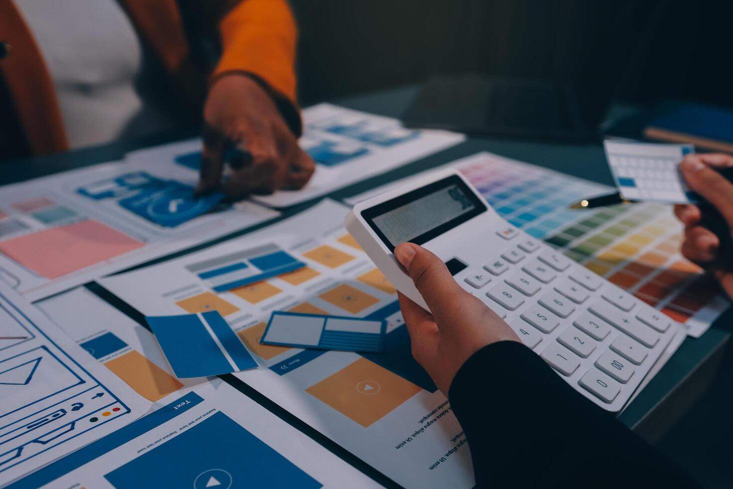 The designer team is designing the uxui system to make the uxui system work well on new phones and support system updates. Website development concept UI UX front end designer photo