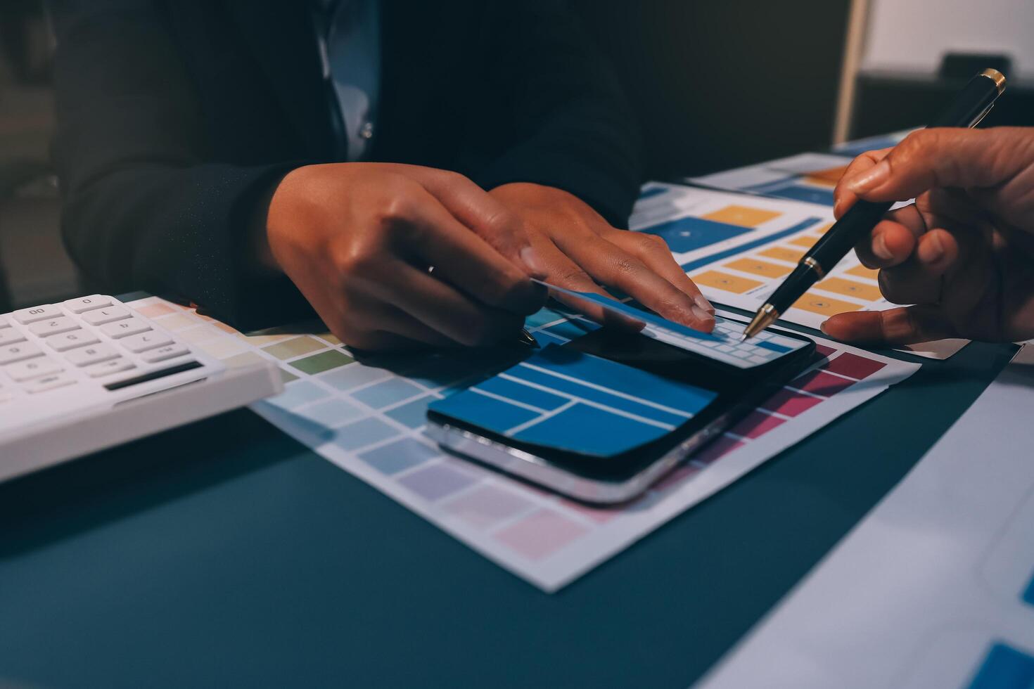 The designer team is designing the uxui system to make the uxui system work well on new phones and support system updates. Website development concept UI UX front end designer photo