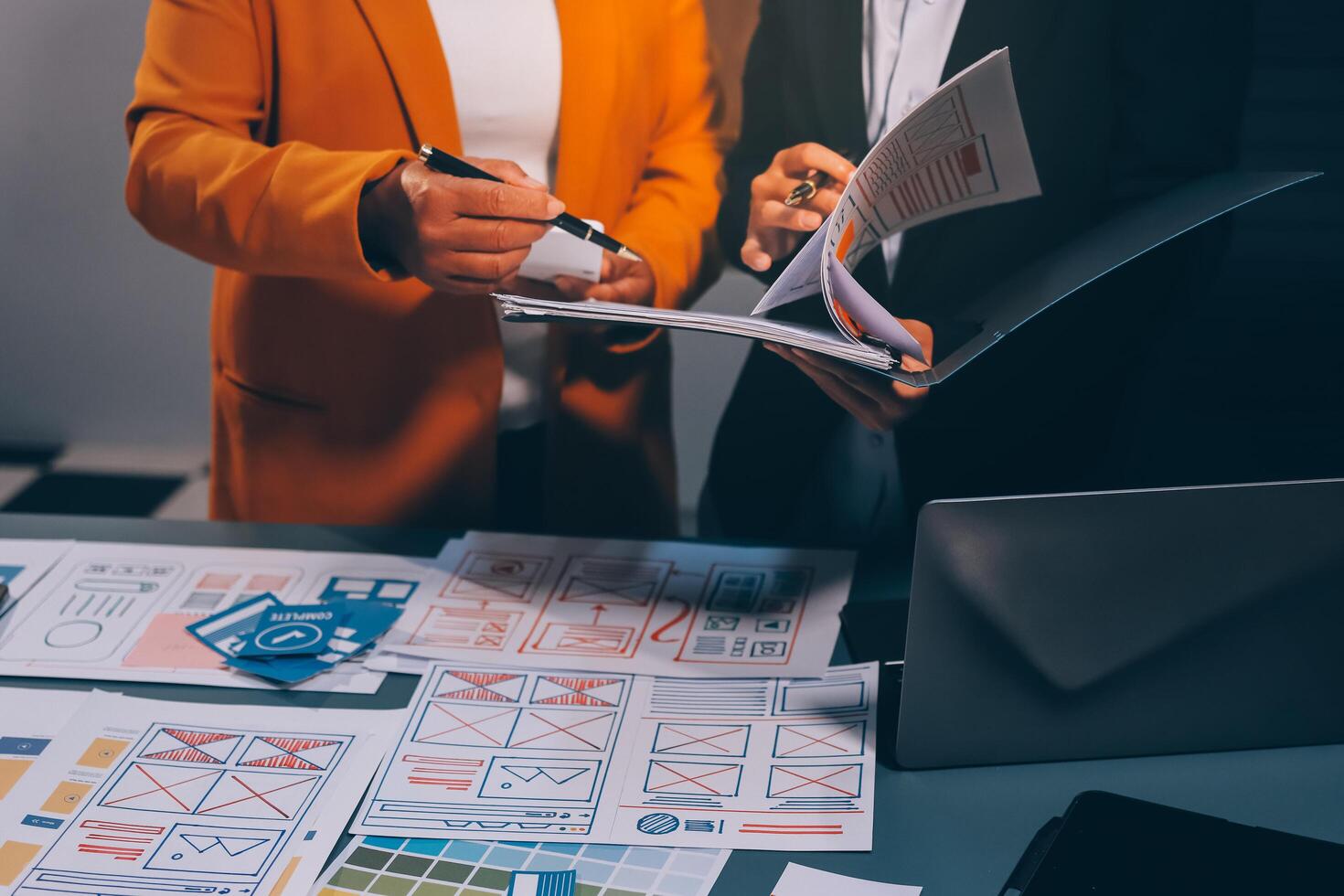 The designer team is designing the uxui system to make the uxui system work well on new phones and support system updates. Website development concept UI UX front end designer photo