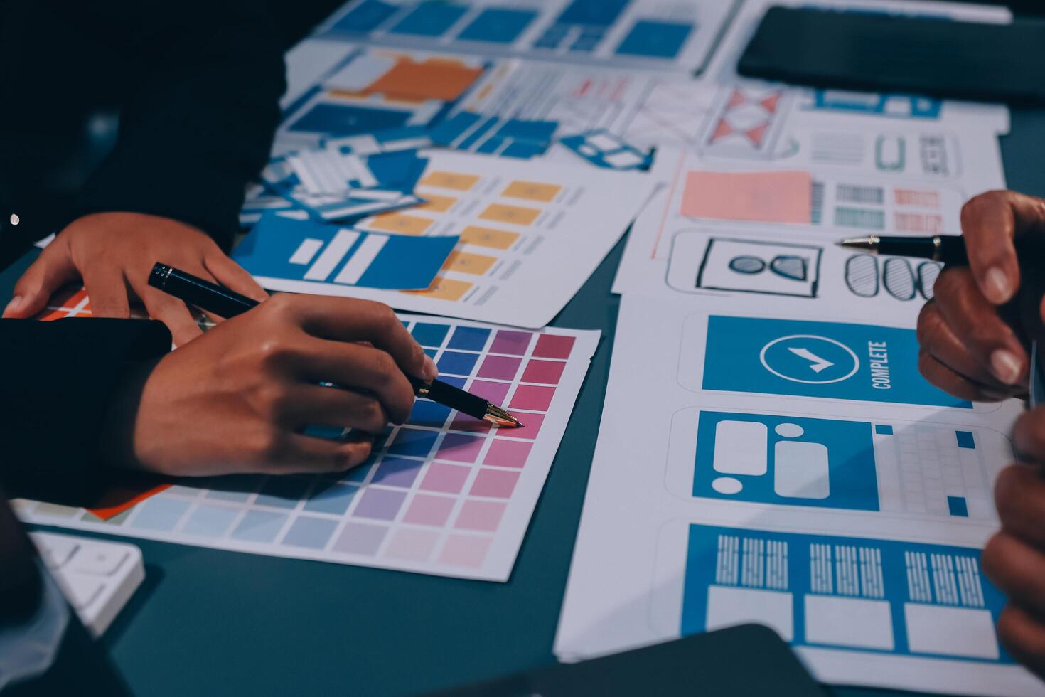 The designer team is designing the uxui system to make the uxui system work well on new phones and support system updates. Website development concept UI UX front end designer photo
