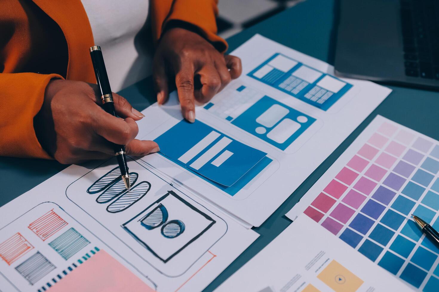 The designer team is designing the uxui system to make the uxui system work well on new phones and support system updates. Website development concept UI UX front end designer photo