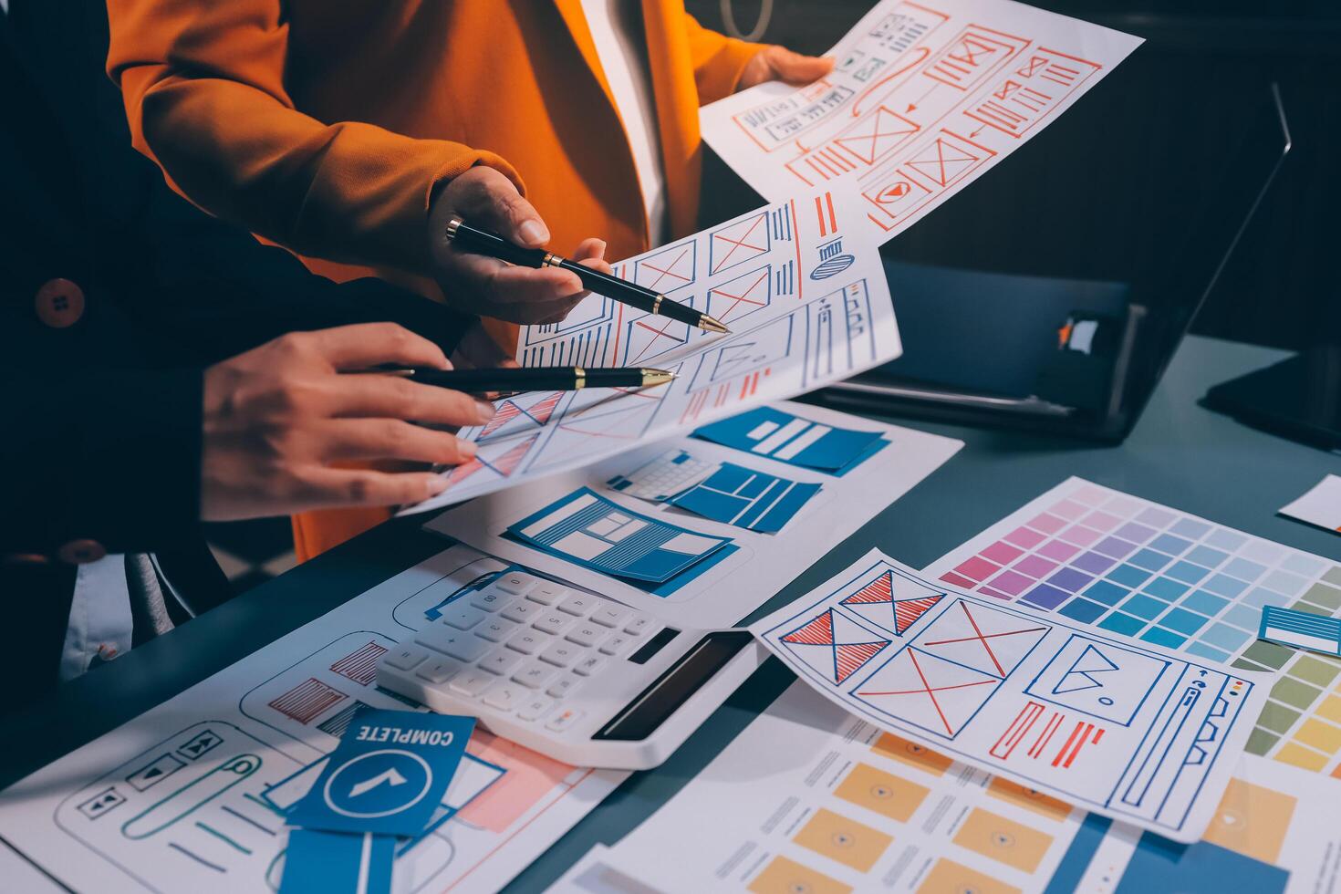The designer team is designing the uxui system to make the uxui system work well on new phones and support system updates. Website development concept UI UX front end designer photo