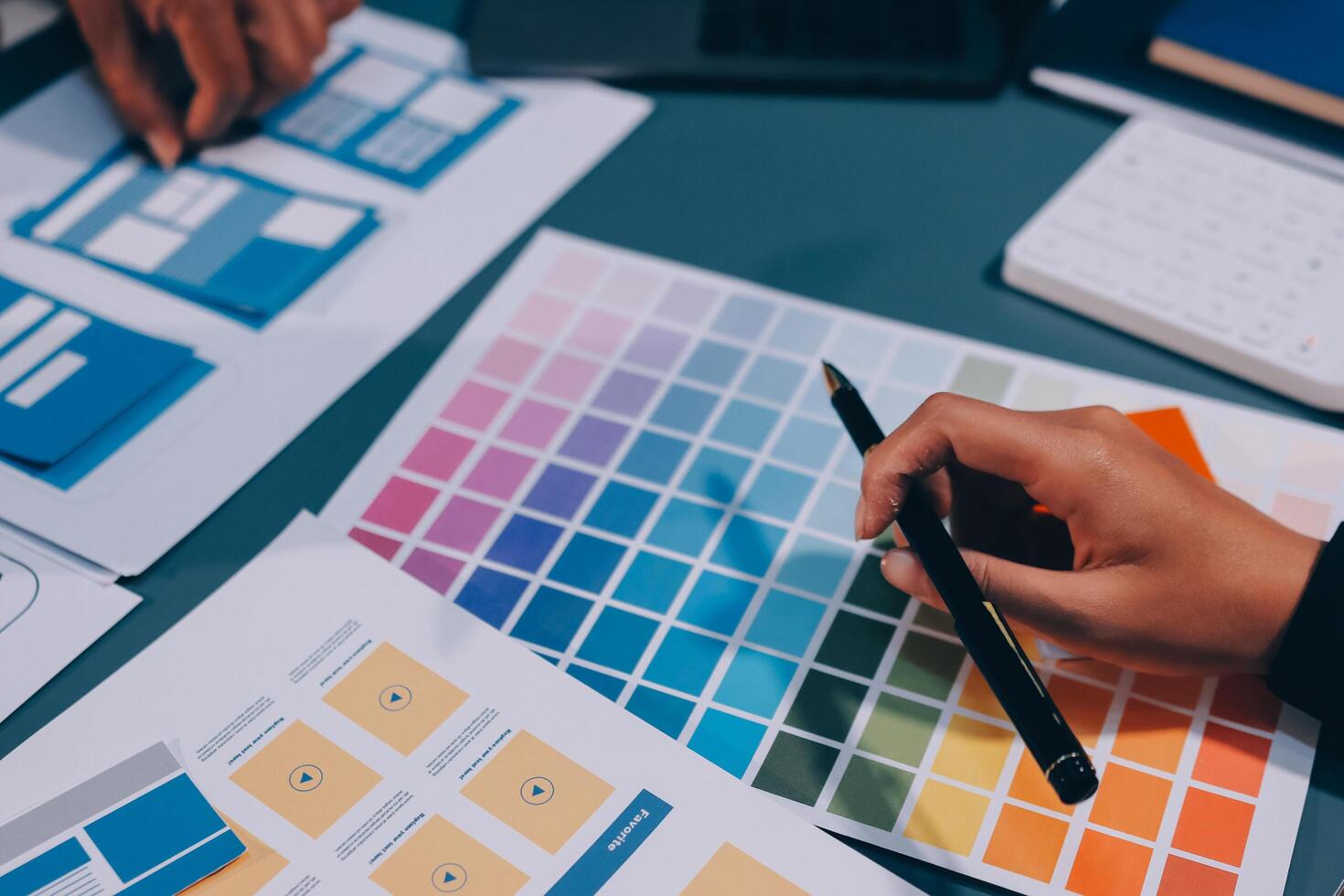 The designer team is designing the uxui system to make the uxui system work well on new phones and support system updates. Website development concept UI UX front end designer photo