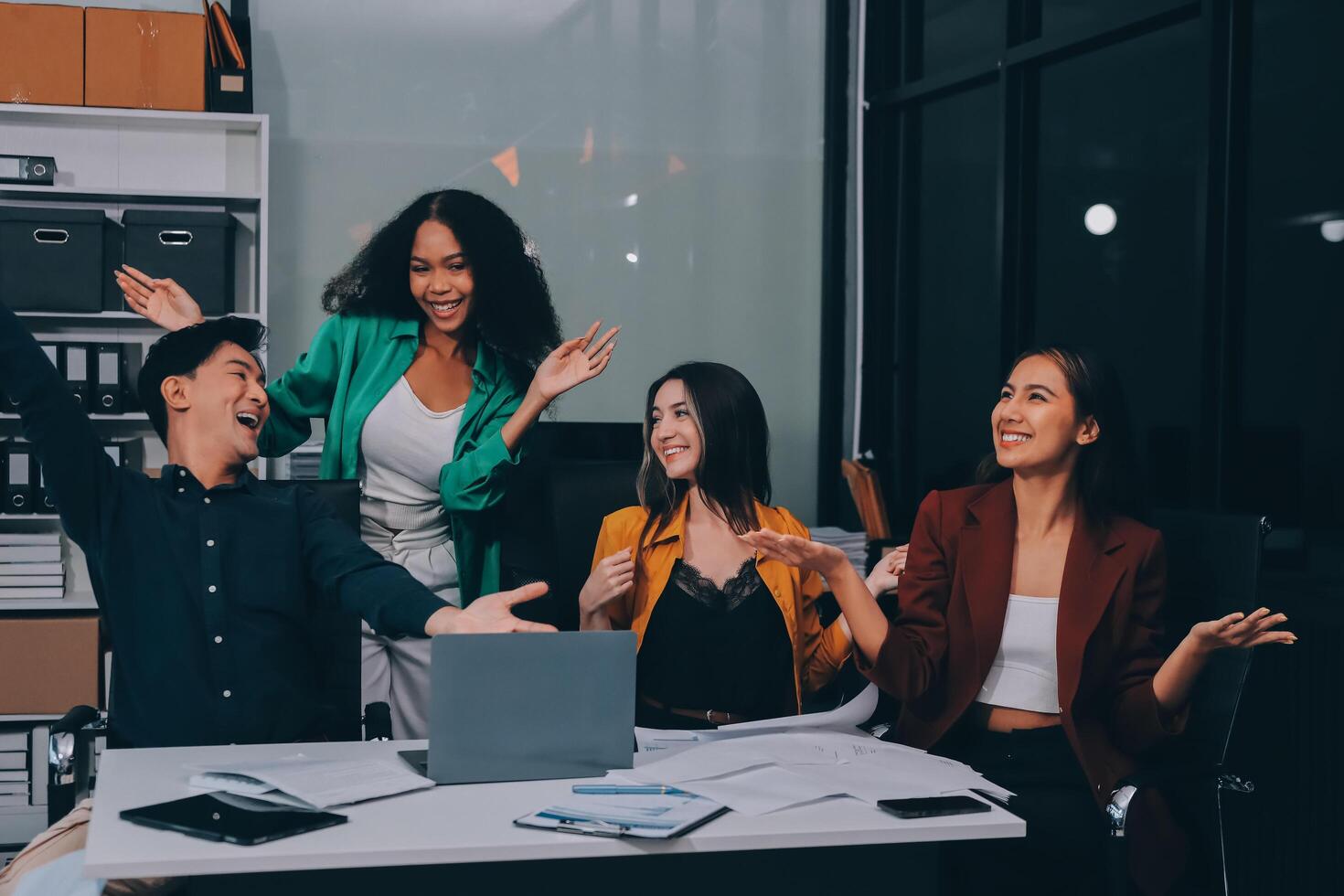 Motivated funny diverse business team people dancing celebrating success at corporate party on friday, happy friendly multiracial coworkers group having fun together enjoy victory dance in office photo