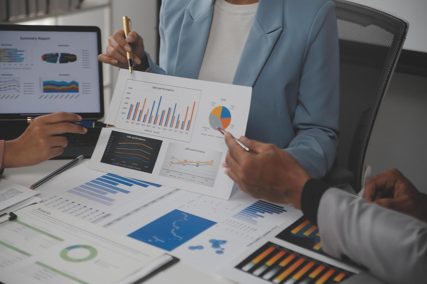 Close up of Business team analyzing income charts and graphs with modern laptop computer. Business analysis and strategy concept. photo