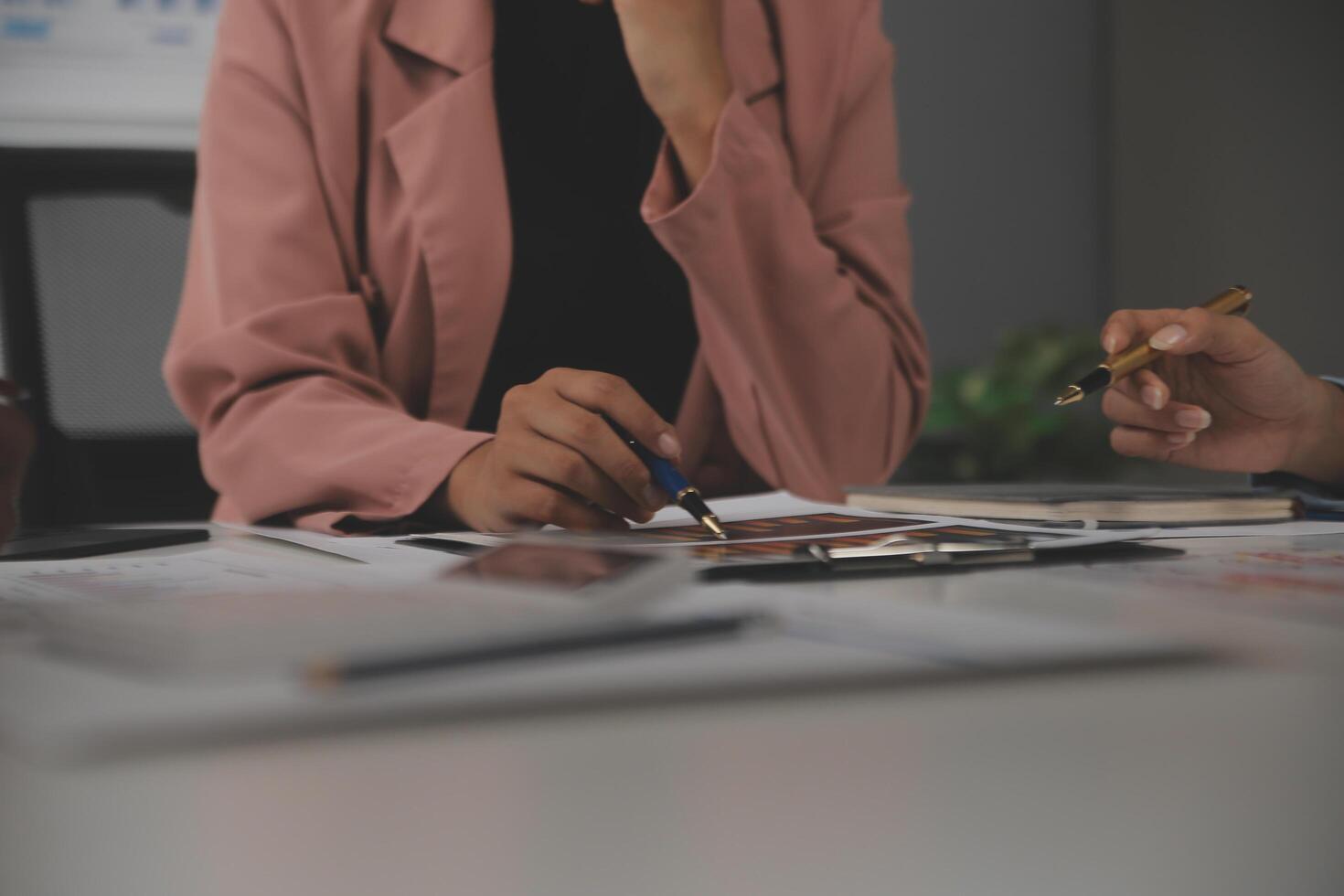 Close up of Business team analyzing income charts and graphs with modern laptop computer. Business analysis and strategy concept. photo
