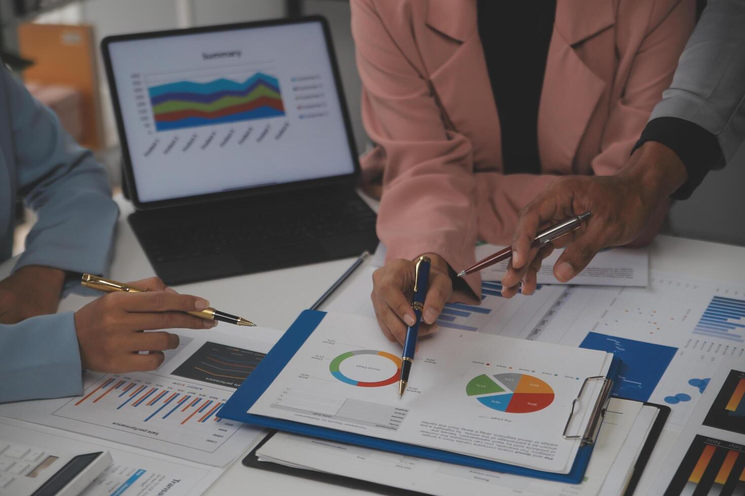 Close up of Business team analyzing income charts and graphs with modern laptop computer. Business analysis and strategy concept. photo