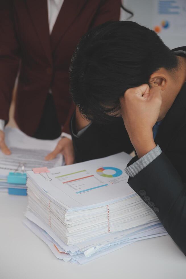 Audit concept,Administrator business man financial inspector and secretary making report calculating balance. Internal Revenue Service checking document. photo