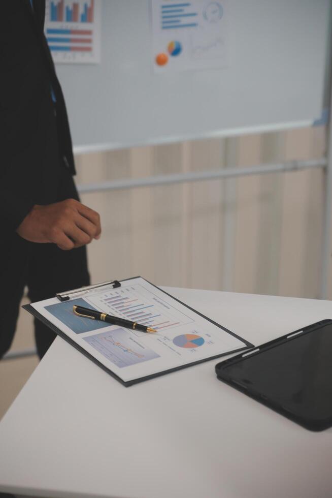 Audit concept,Administrator business man financial inspector and secretary making report calculating balance. Internal Revenue Service checking document. photo