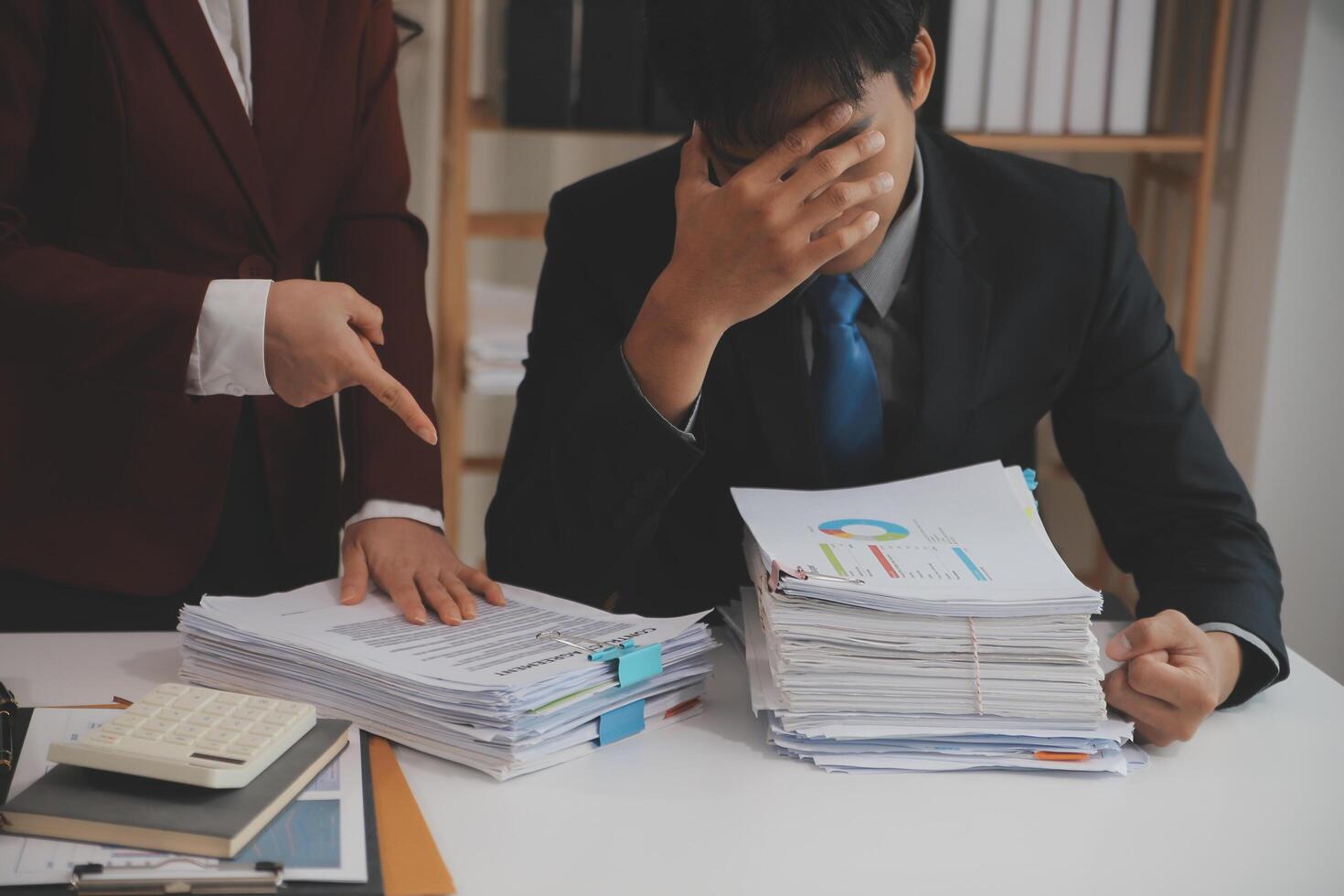 Audit concept,Administrator business man financial inspector and secretary making report calculating balance. Internal Revenue Service checking document. photo