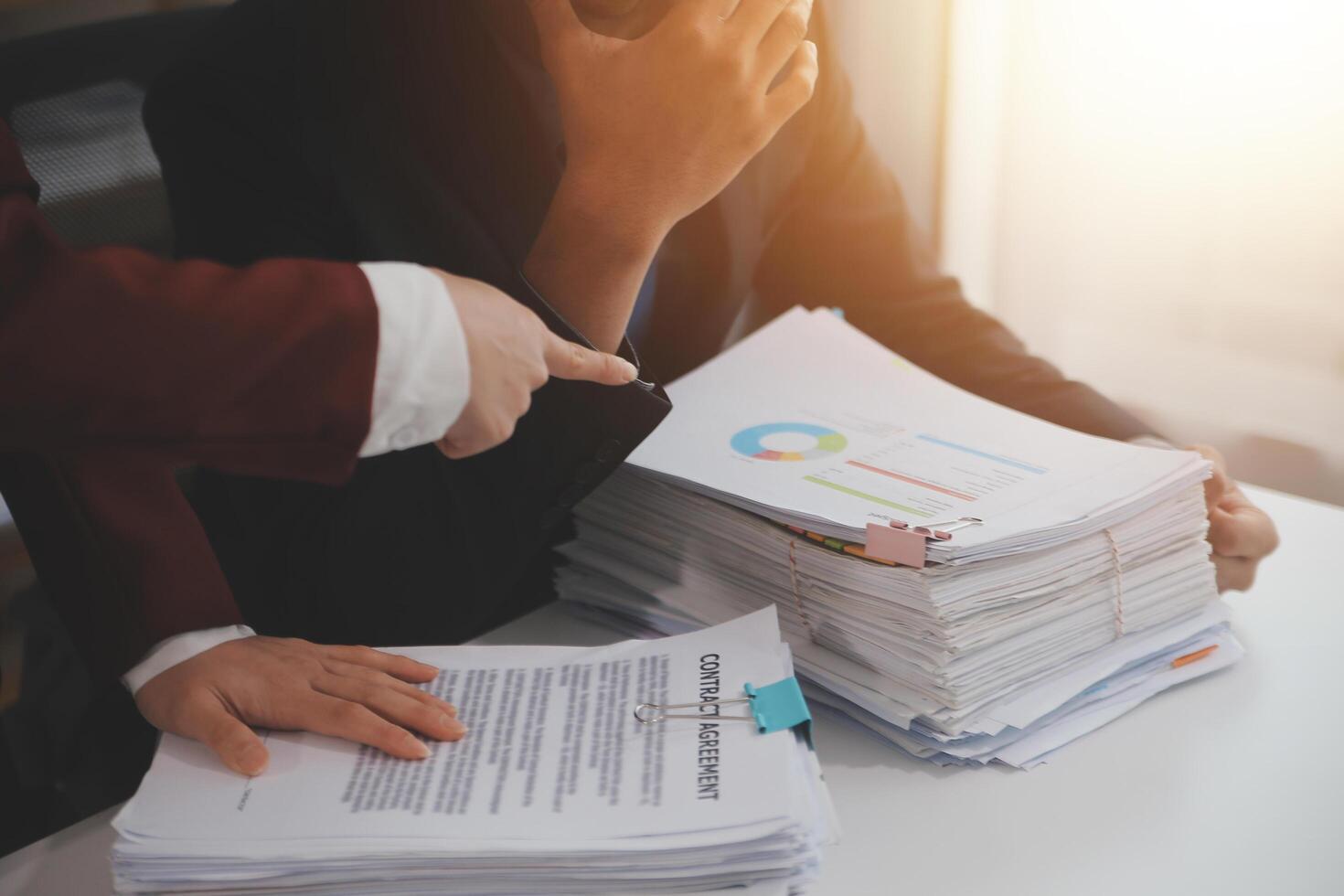 Audit concept,Administrator business man financial inspector and secretary making report calculating balance. Internal Revenue Service checking document. photo