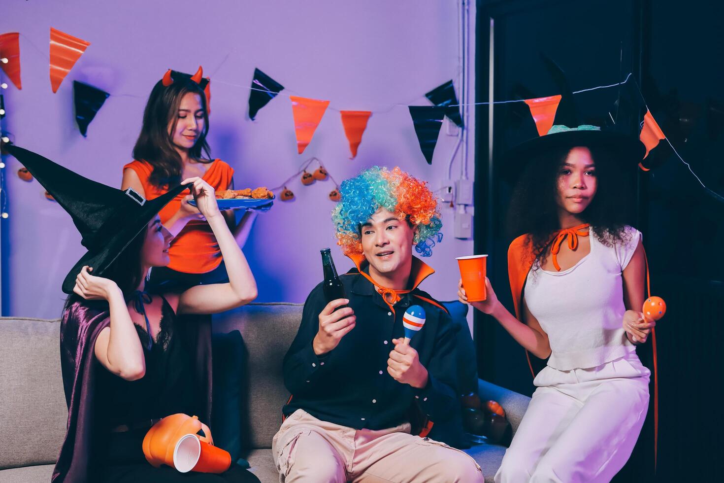 Joyful office Halloween party with coworkers in costumes, celebrating with drinks and laughter, fostering teamwork and festive spirit photo