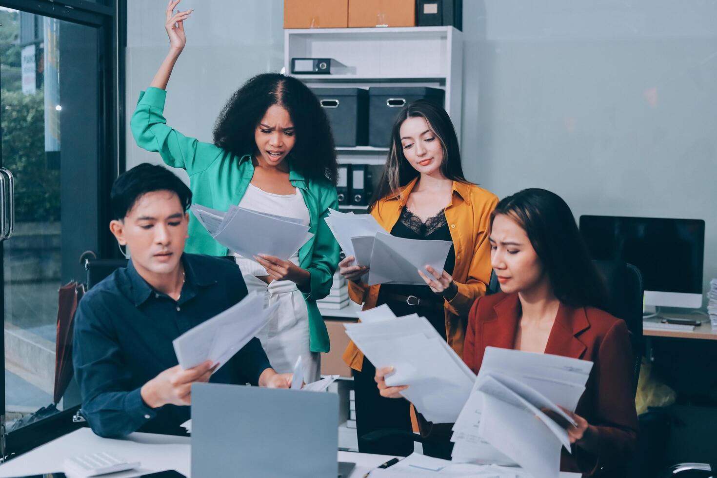 Stress, business people and employee frustrated with multitasking, pressure or overworked by team in chaos with paperwork. Anxiety, headache and worker overwhelmed by group and burnout in crisis photo
