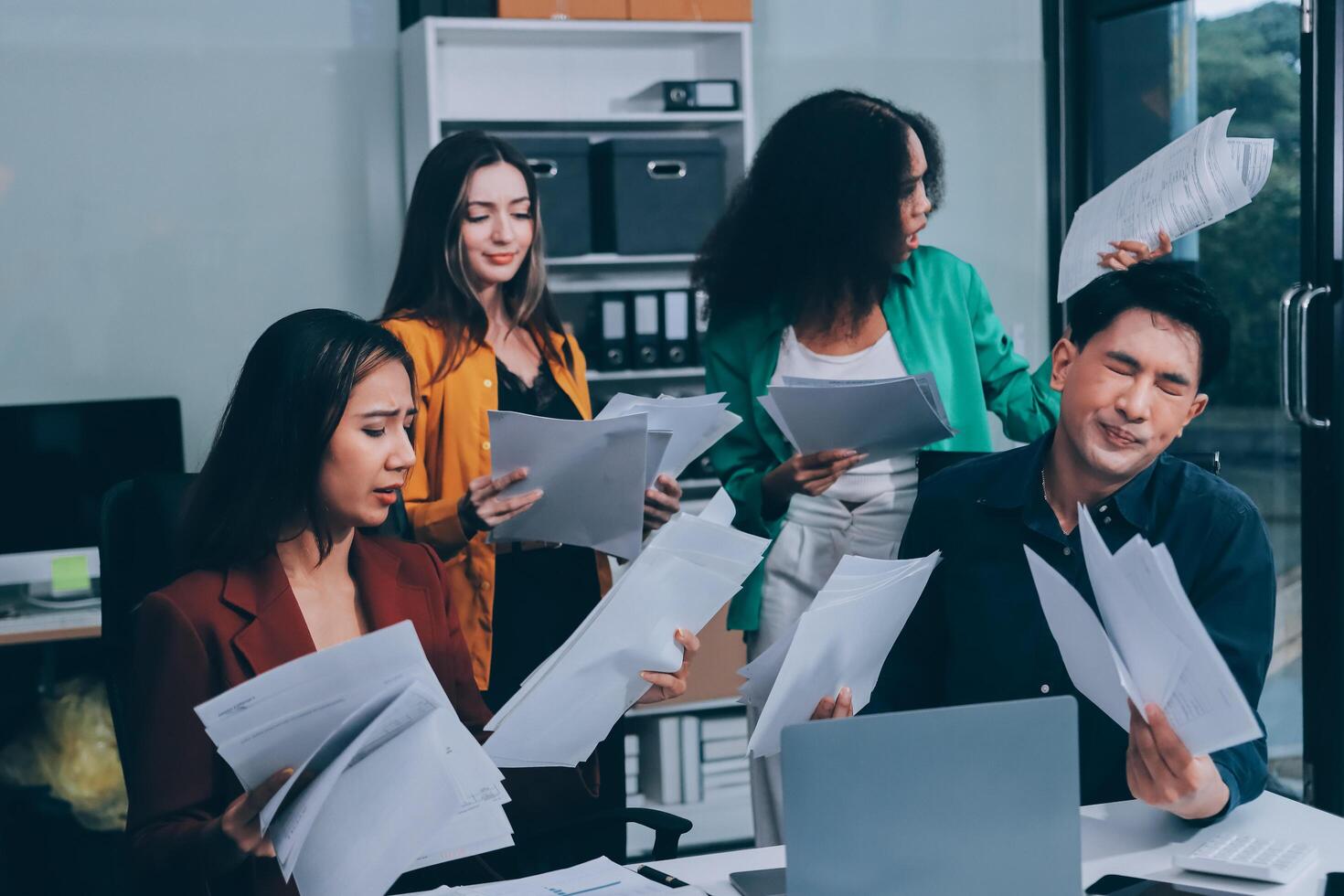 Stress, business people and employee frustrated with multitasking, pressure or overworked by team in chaos with paperwork. Anxiety, headache and worker overwhelmed by group and burnout in crisis photo