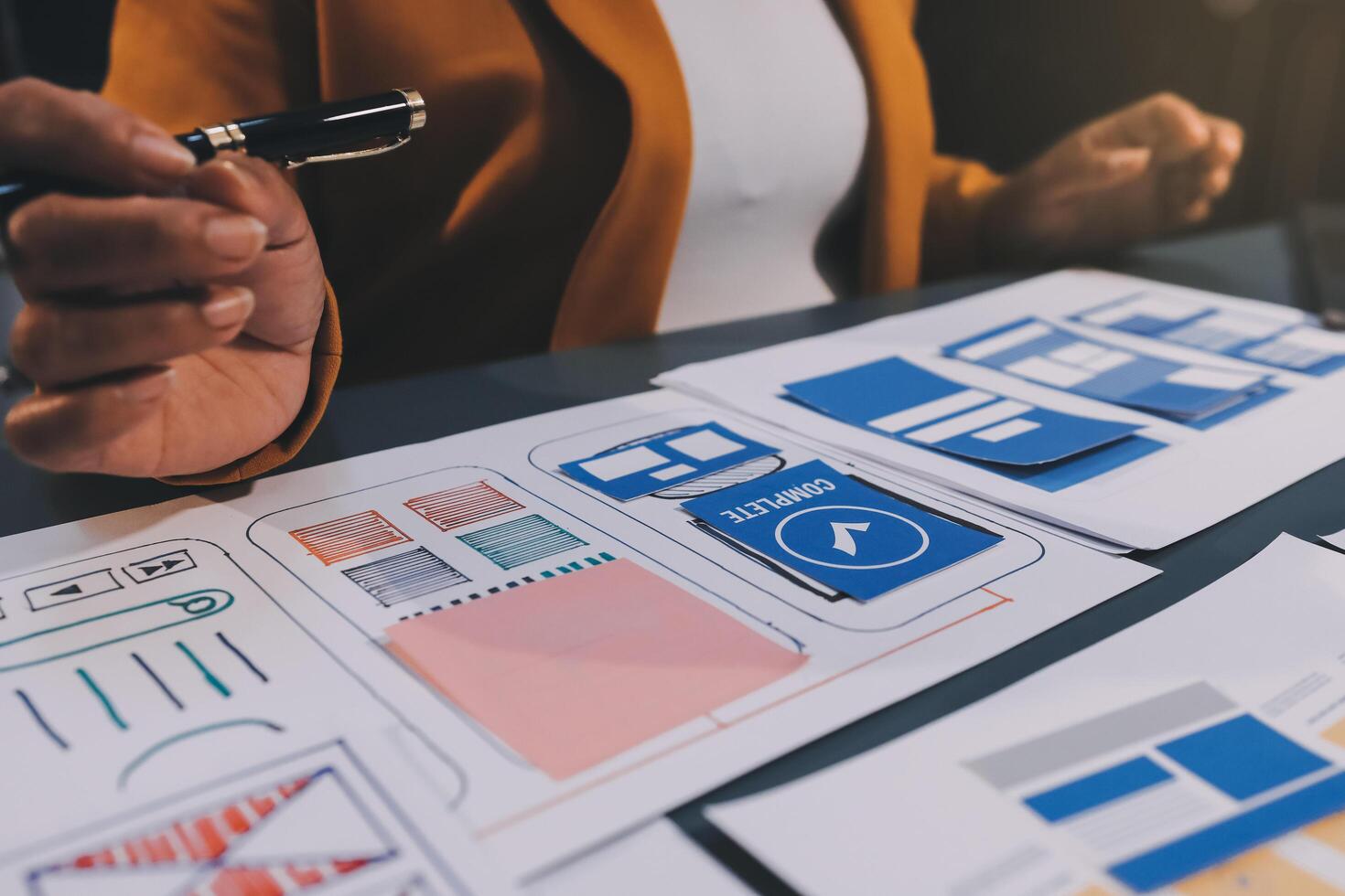 The designer team is designing the uxui system to make the uxui system work well on new phones and support system updates. Website development concept UI UX front end designer photo