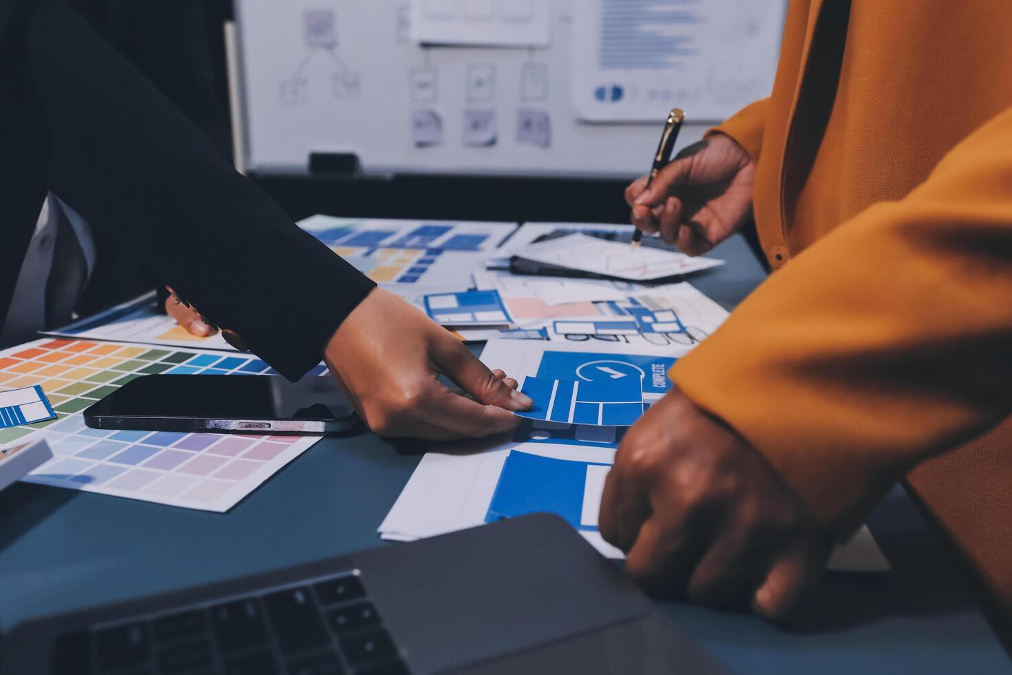 The designer team is designing the uxui system to make the uxui system work well on new phones and support system updates. Website development concept UI UX front end designer photo
