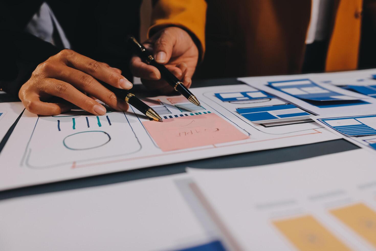 The designer team is designing the uxui system to make the uxui system work well on new phones and support system updates. Website development concept UI UX front end designer photo
