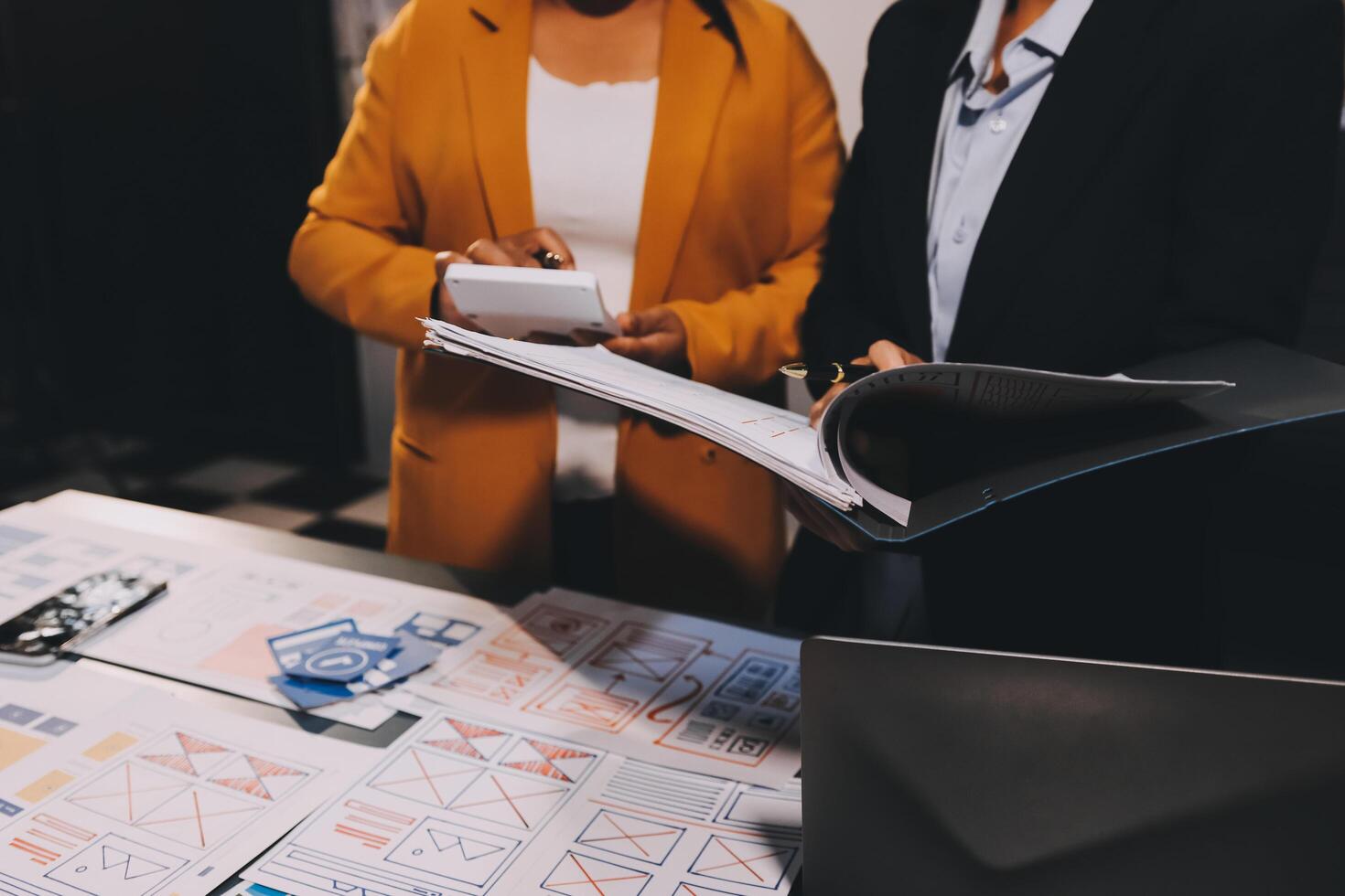 The designer team is designing the uxui system to make the uxui system work well on new phones and support system updates. Website development concept UI UX front end designer photo