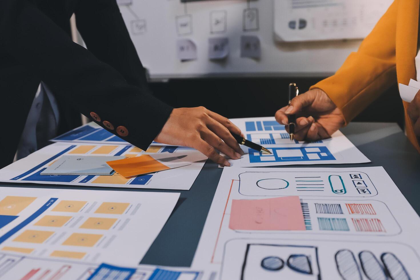 The designer team is designing the uxui system to make the uxui system work well on new phones and support system updates. Website development concept UI UX front end designer photo