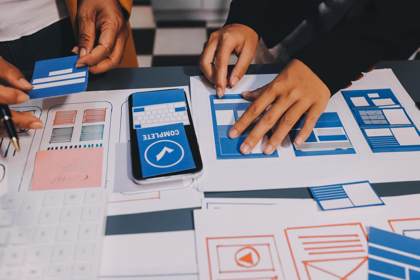 The designer team is designing the uxui system to make the uxui system work well on new phones and support system updates. Website development concept UI UX front end designer photo