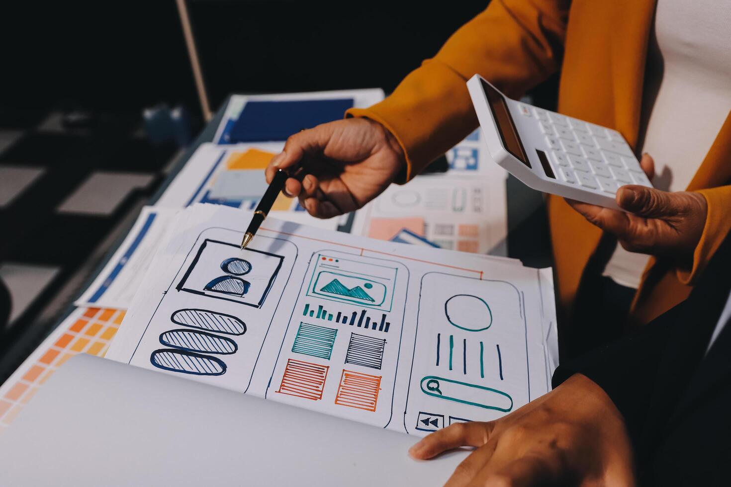 The designer team is designing the uxui system to make the uxui system work well on new phones and support system updates. Website development concept UI UX front end designer photo