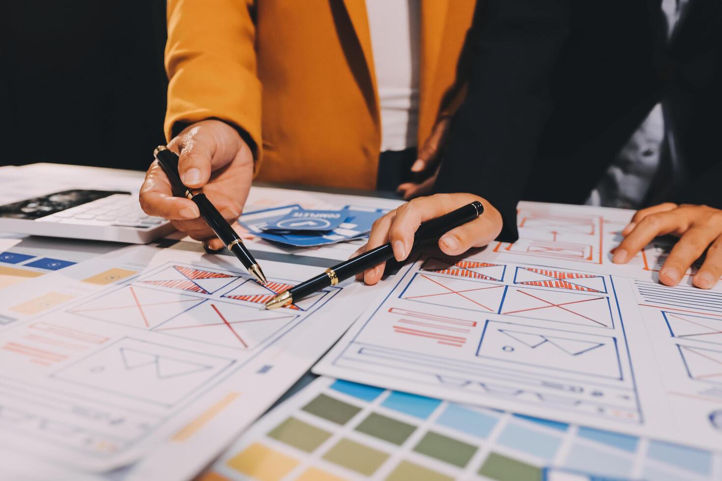 The designer team is designing the uxui system to make the uxui system work well on new phones and support system updates. Website development concept UI UX front end designer photo