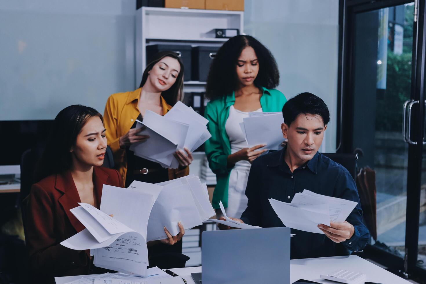 Stress, business people and employee frustrated with multitasking, pressure or overworked by team in chaos with paperwork. Anxiety, headache and worker overwhelmed by group and burnout in crisis photo