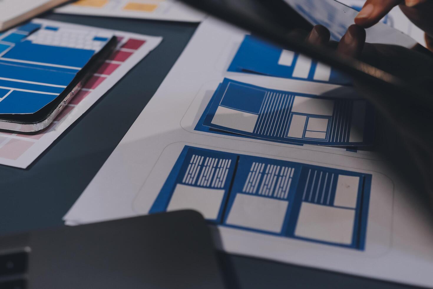 The designer team is designing the uxui system to make the uxui system work well on new phones and support system updates. Website development concept UI UX front end designer photo