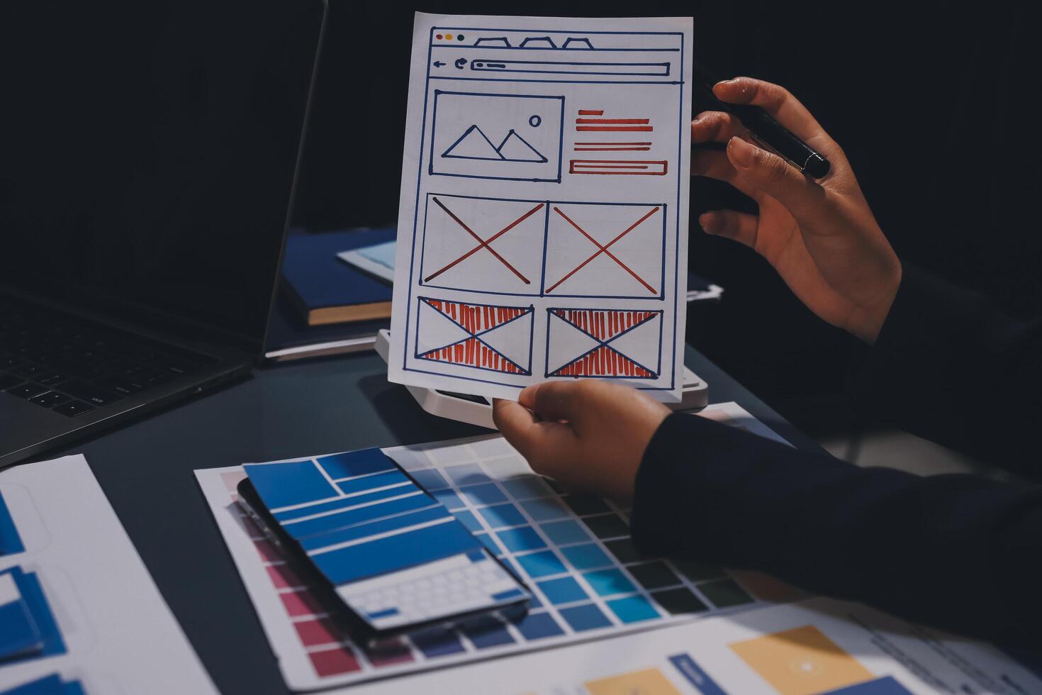 The designer team is designing the uxui system to make the uxui system work well on new phones and support system updates. Website development concept UI UX front end designer photo