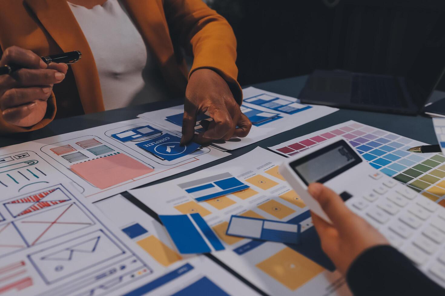 The designer team is designing the uxui system to make the uxui system work well on new phones and support system updates. Website development concept UI UX front end designer photo