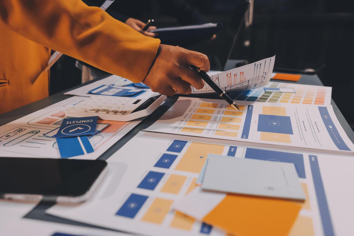 The designer team is designing the uxui system to make the uxui system work well on new phones and support system updates. Website development concept UI UX front end designer photo