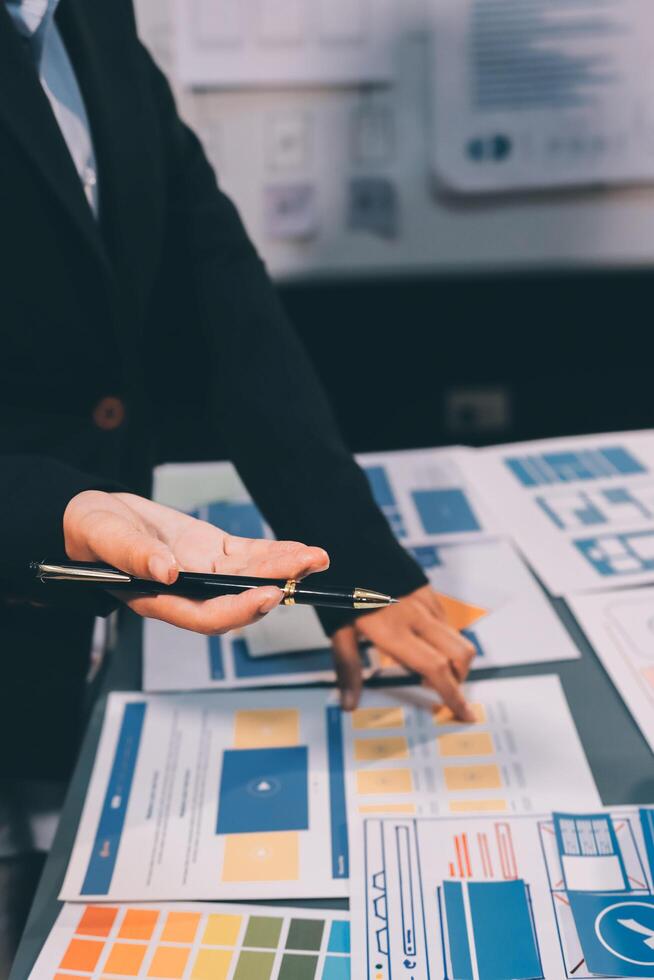 The designer team is designing the uxui system to make the uxui system work well on new phones and support system updates. Website development concept UI UX front end designer photo