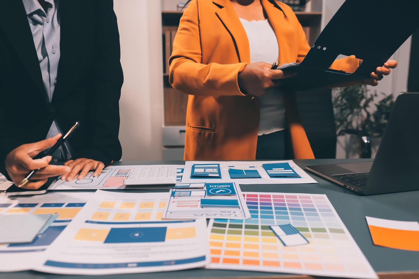The designer team is designing the uxui system to make the uxui system work well on new phones and support system updates. Website development concept UI UX front end designer photo