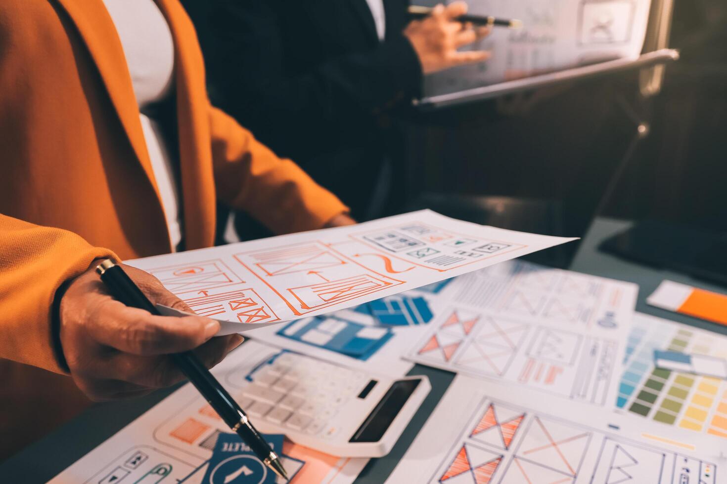 The designer team is designing the uxui system to make the uxui system work well on new phones and support system updates. Website development concept UI UX front end designer photo