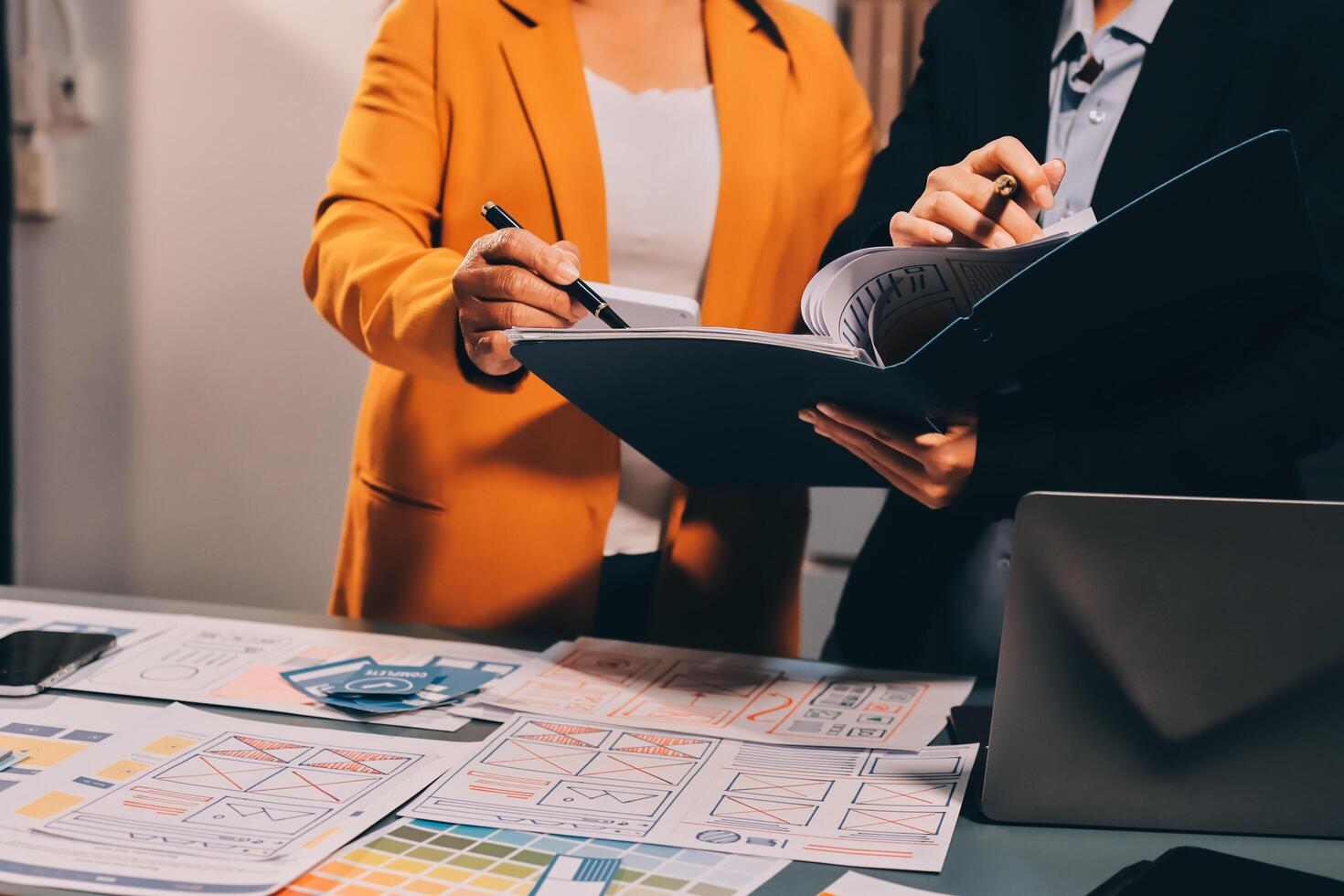 The designer team is designing the uxui system to make the uxui system work well on new phones and support system updates. Website development concept UI UX front end designer photo