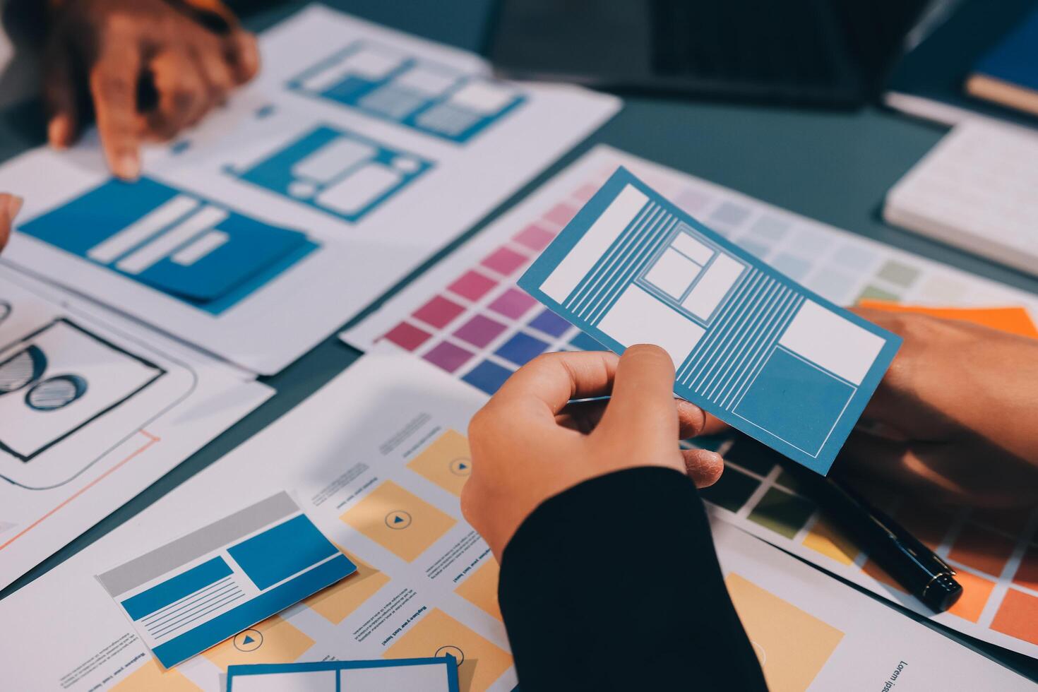 The designer team is designing the uxui system to make the uxui system work well on new phones and support system updates. Website development concept UI UX front end designer photo