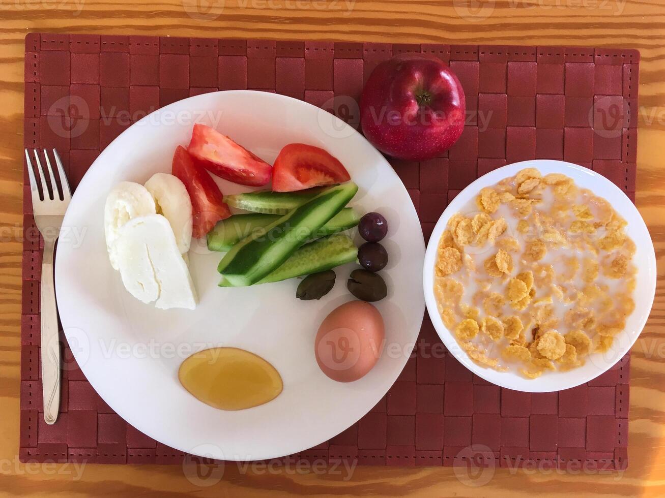 Healthy breakfast vegetable with boiled egg, cheese and cereal with milk photo