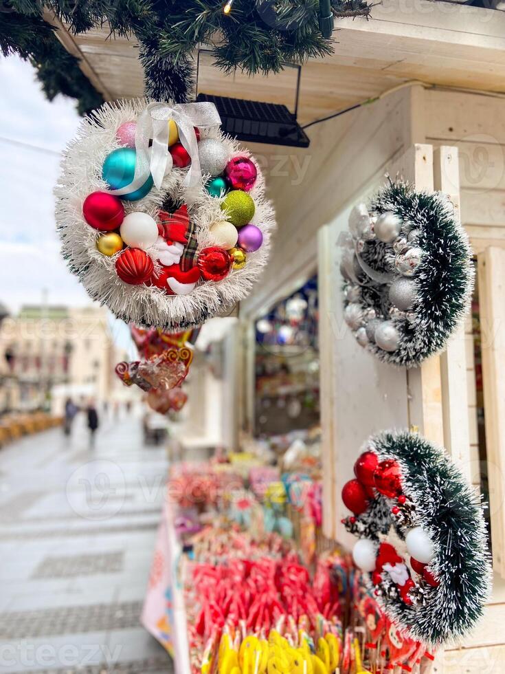 Decor on a festive Christmas market stall. Vibrant array of sweets. Inviting and cheerful atmosphere winter holidays. photo
