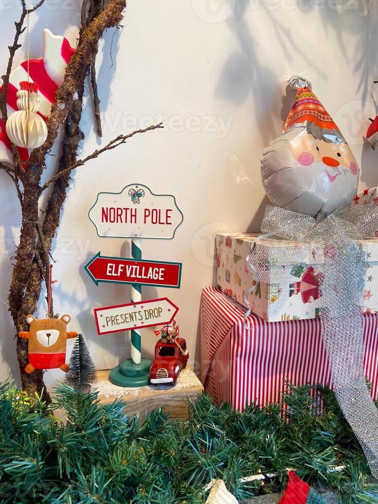Christmas decor with a cute snowman toy and Christmas tree branch. Holidays and decorations concept photo