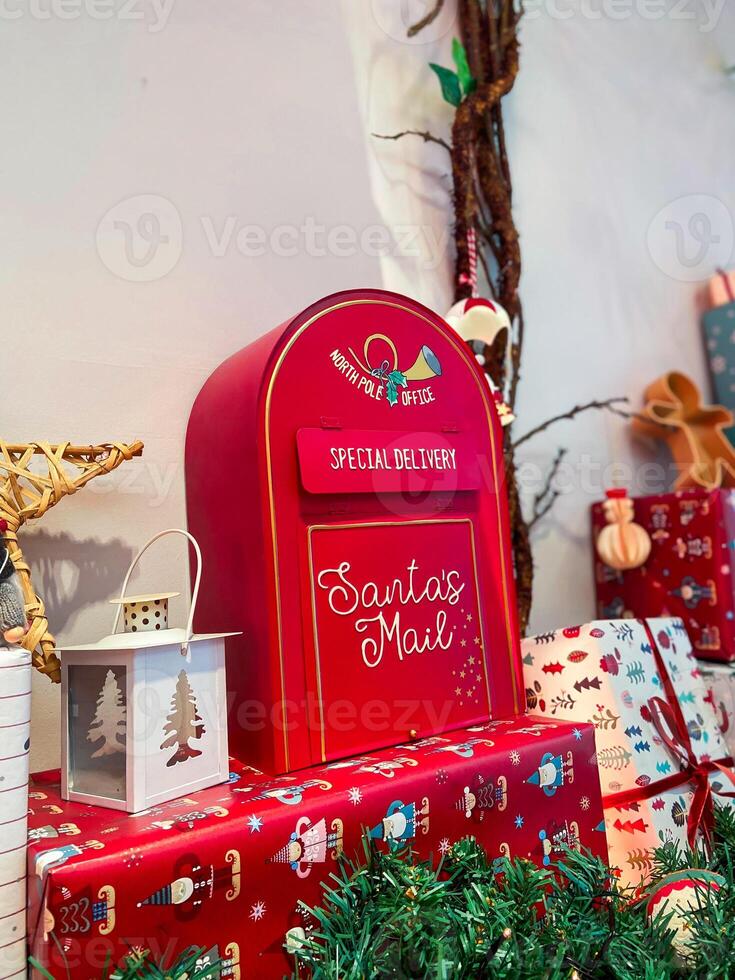Red festive mailbox for letters to santa claus with Christmas decoration. Holidays and mail message concept photo