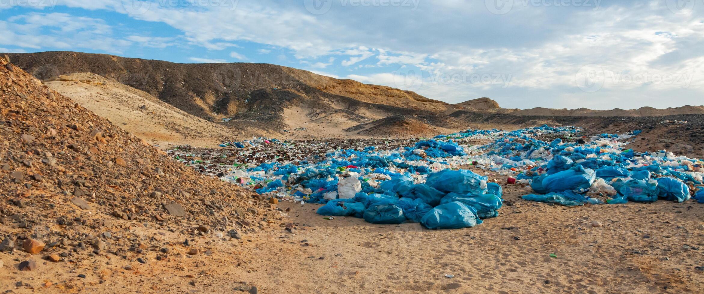 Plastic bottles and various garbage from hotels in the wild, Garbage dump in the desert in Egypt photo