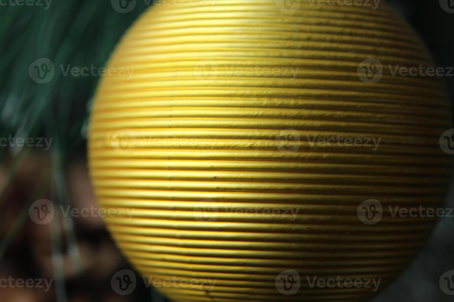 yellow golden textured ball close-up to the place for the text of the copy space photo