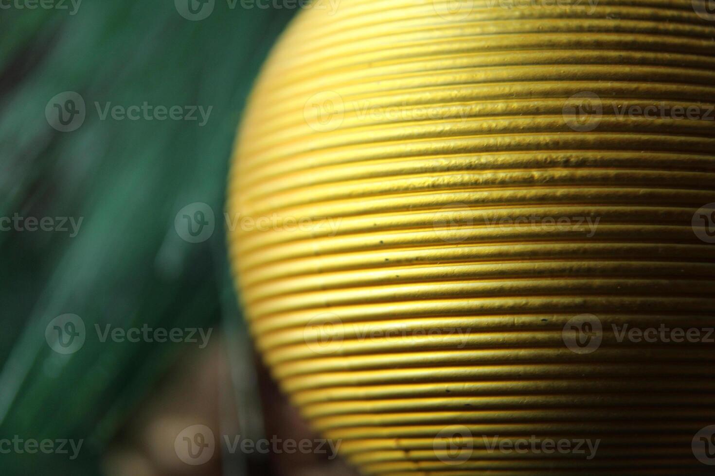 yellow golden textured ball close-up to the place for the text of the copy space photo