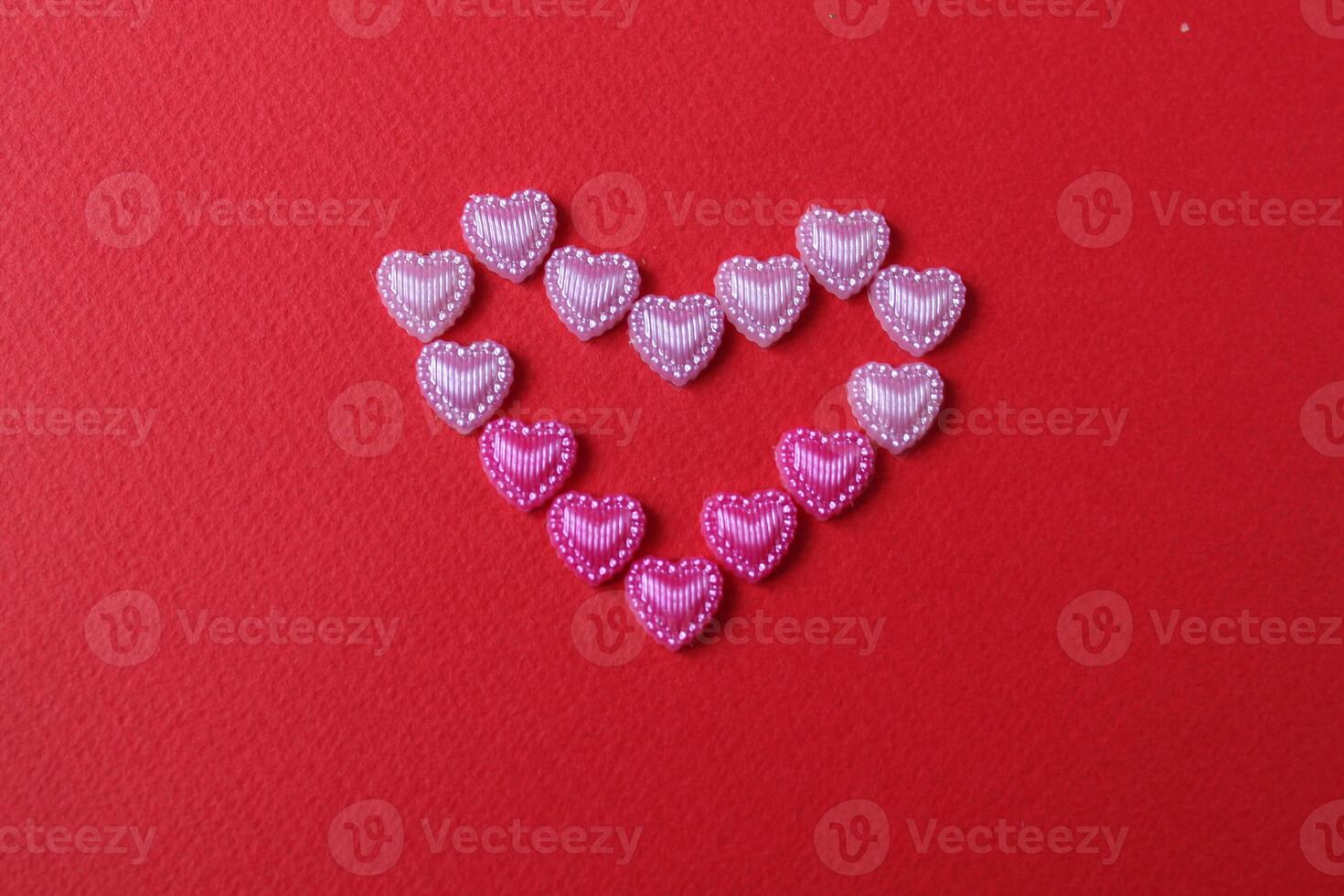 heart of rhinestone hearts on a red bright background with a copy of the space place for text valentine's day photo