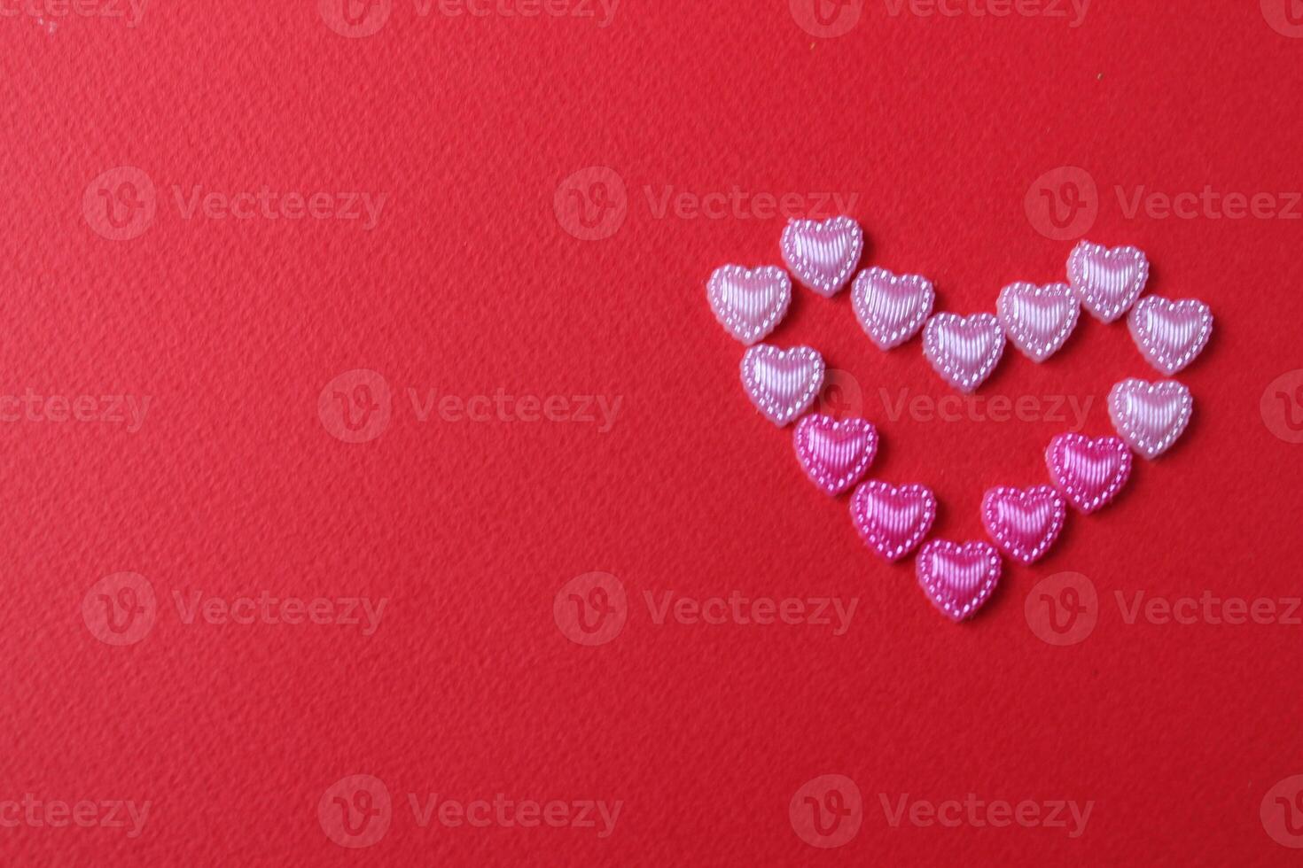 heart of rhinestone hearts on a red bright background with a copy of the space place for text valentine's day photo
