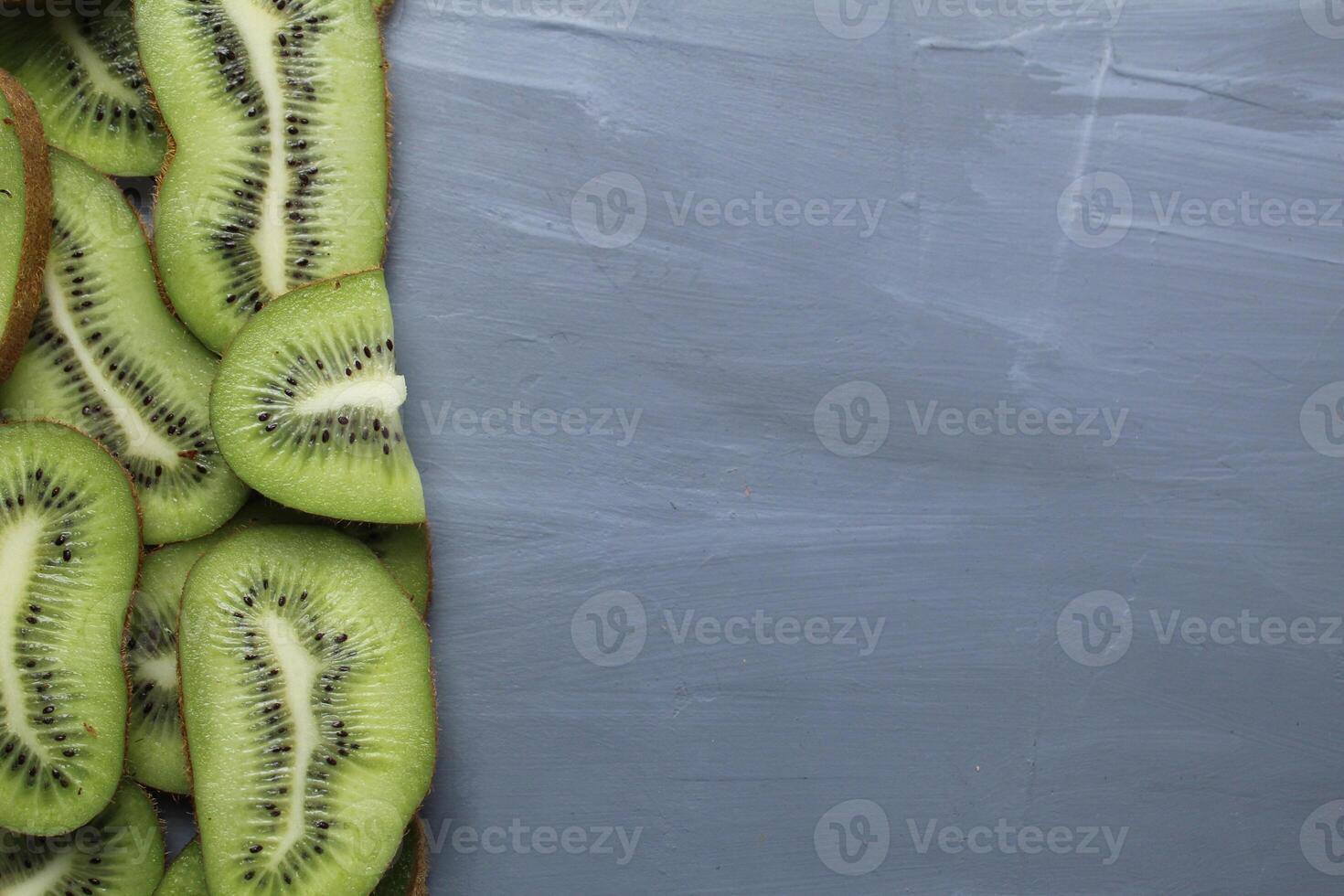 Kiwi Slices Background with free space for the text of the product photo. Concept of Consumption of Local Seasonal Kiwi Fruit Products photo