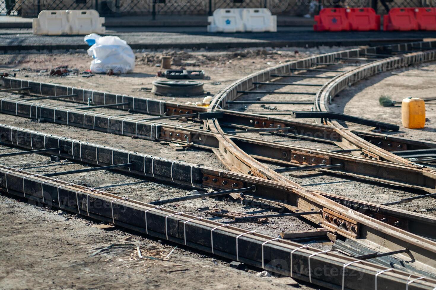 Major tram track overhaul on closed city street. Rail junction with beams, tools awaiting completion photo