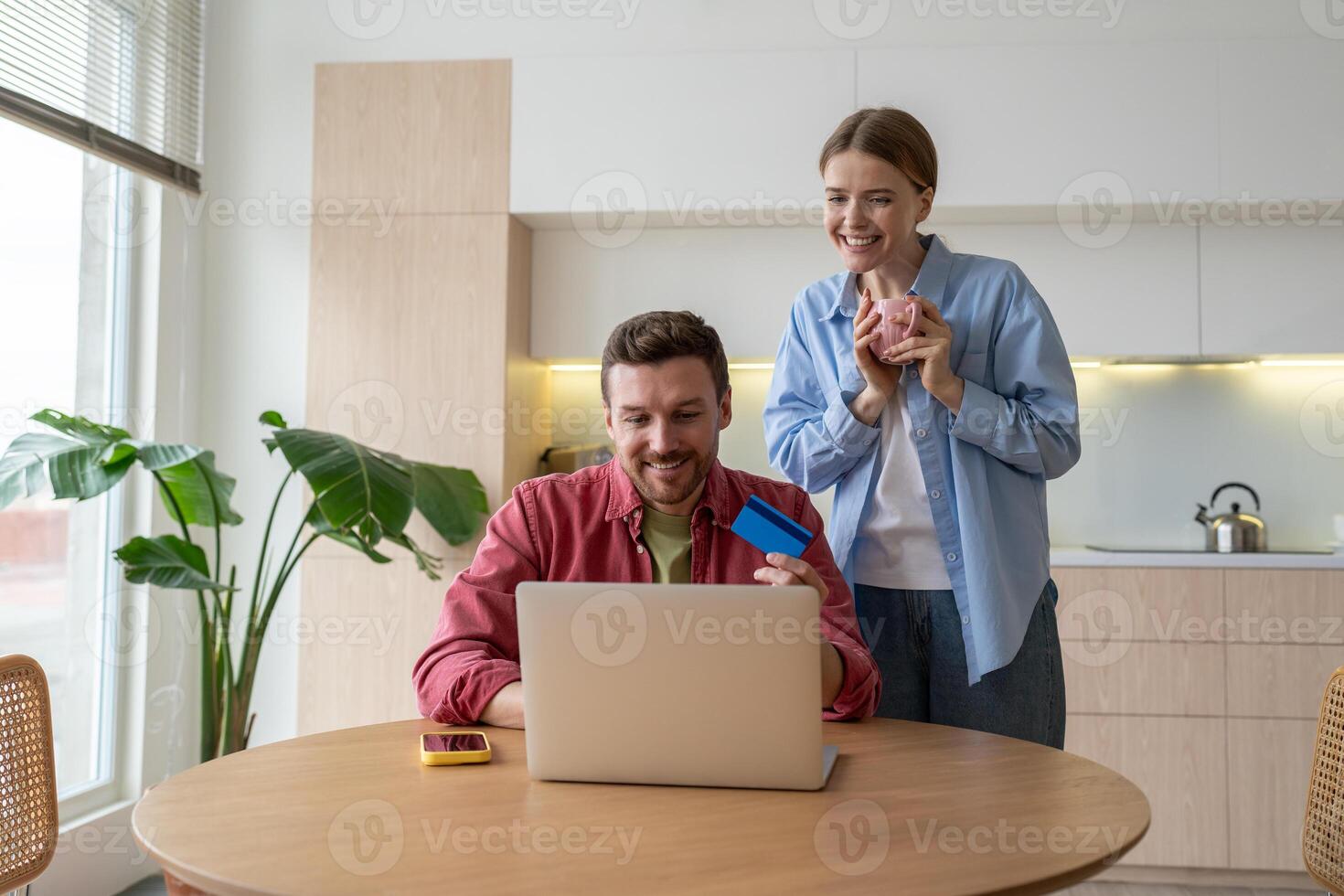 Happy romantic couple surf internet, shopping online from home. Presents for lovers, family purchase photo