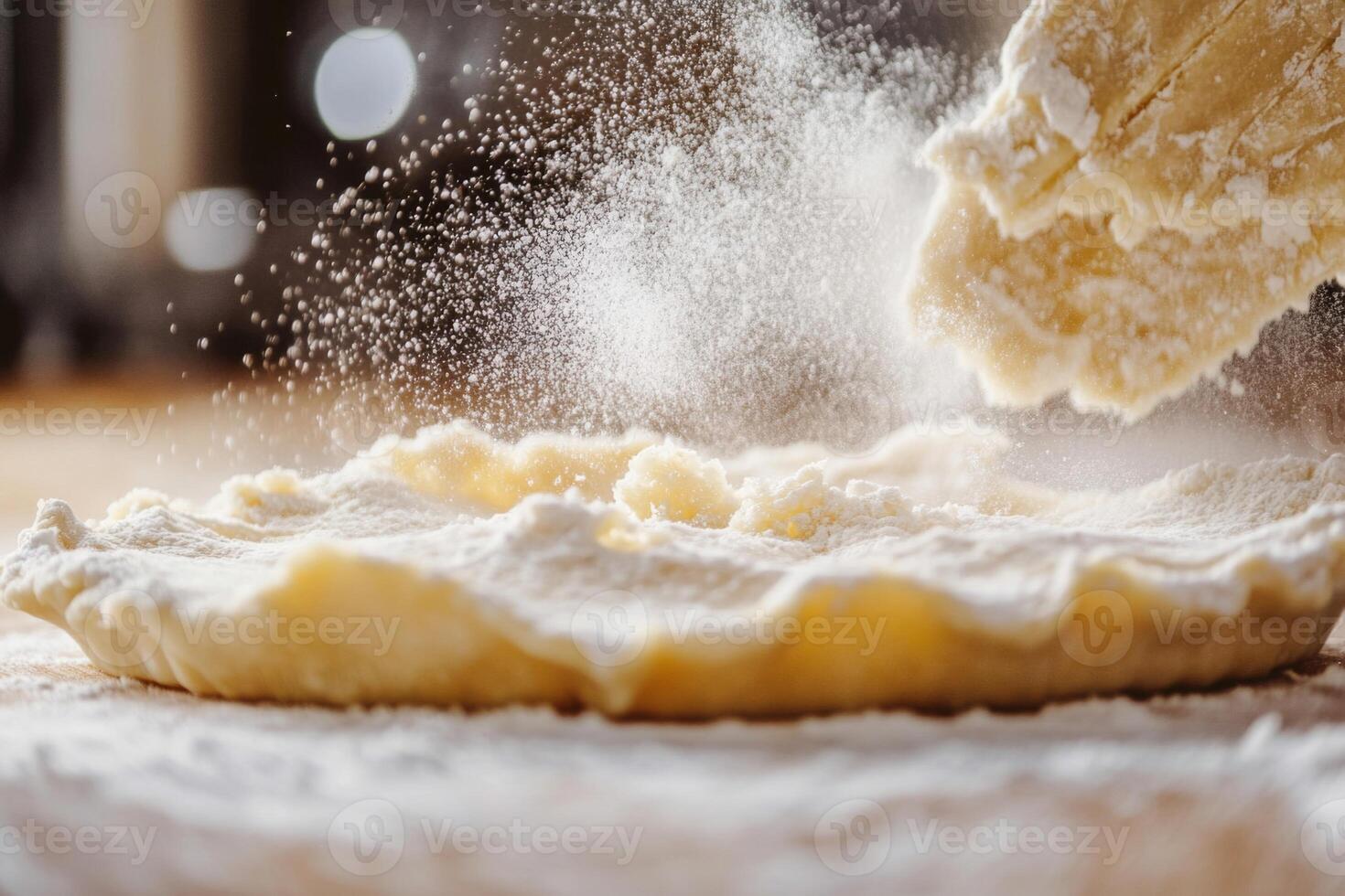 Dough Being Dusted with Flour During Baking photo